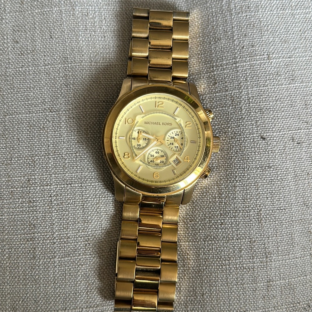Gold Michael Kors large sized watch with extra links